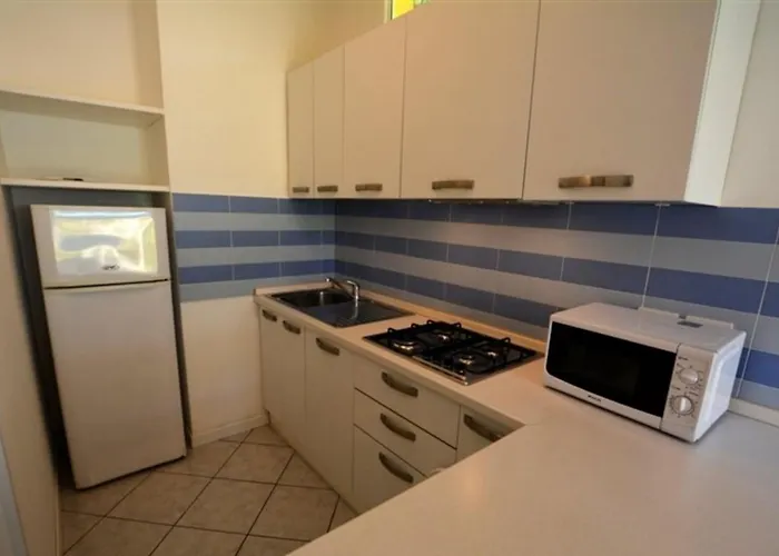 Villa Semi Detached With Private Fenced Garden In Lignano Pineta